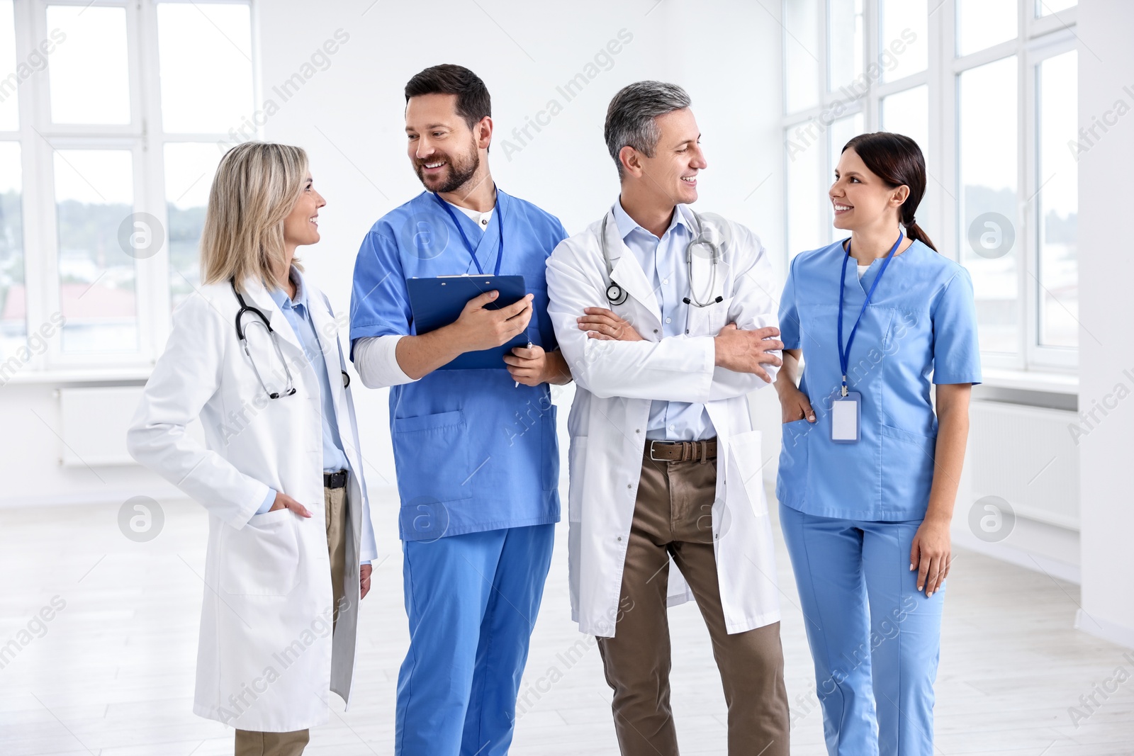 Photo of Team of smiling healthcare workers in hospital