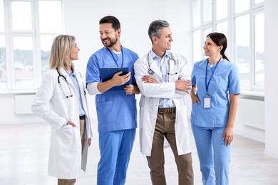 Photo of Team of smiling healthcare workers in hospital