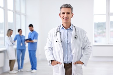 Healthcare workers in hospital, selective focus. Portrait of smiling nurse indoors