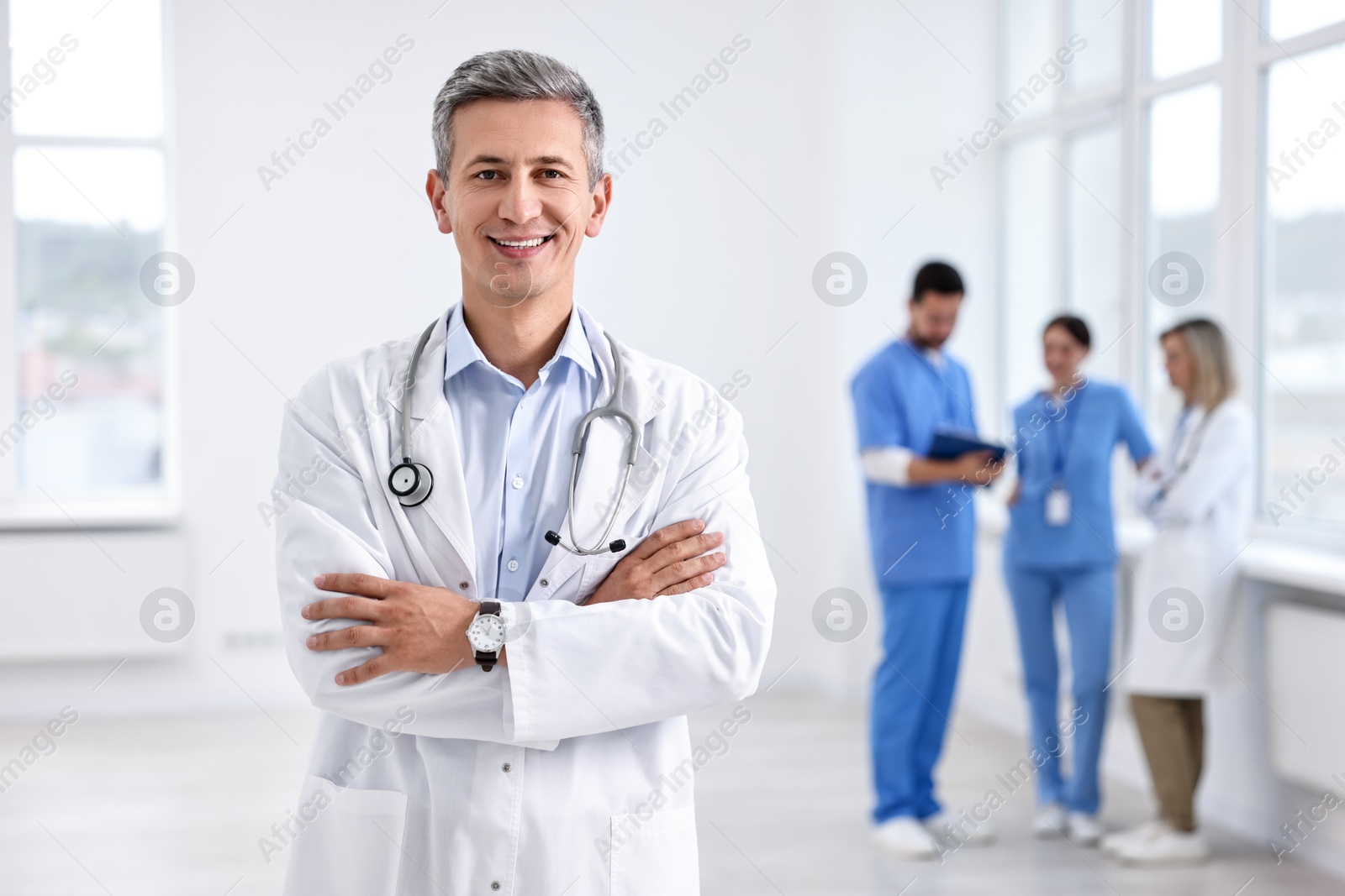 Photo of Healthcare workers in hospital, selective focus. Portrait of smiling nurse indoors