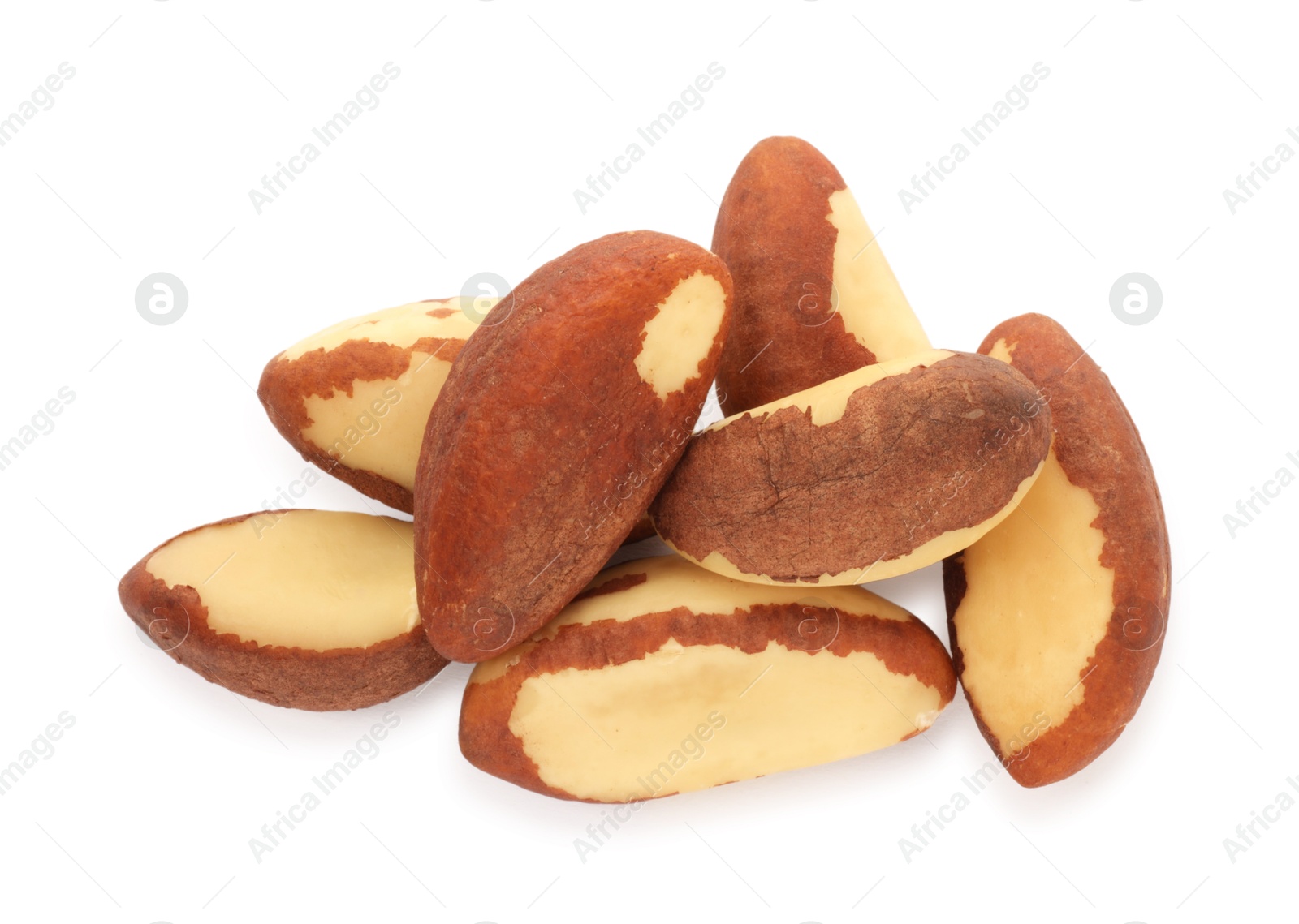 Photo of Heap of Brazil nuts isolated on white, top view