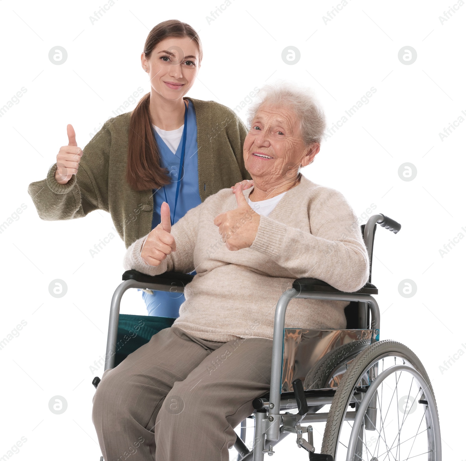 Photo of Caregiver and senior woman showing thumbs up on white background. Home health care service