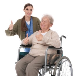 Caregiver and senior woman showing thumbs up on white background. Home health care service