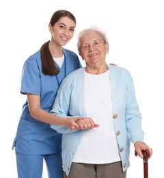 Photo of Caregiver supporting senior woman with walking cane on white background. Home health care service