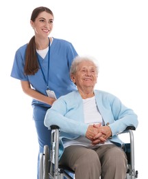 Caregiver assisting senior woman in wheelchair on white background. Home health care service