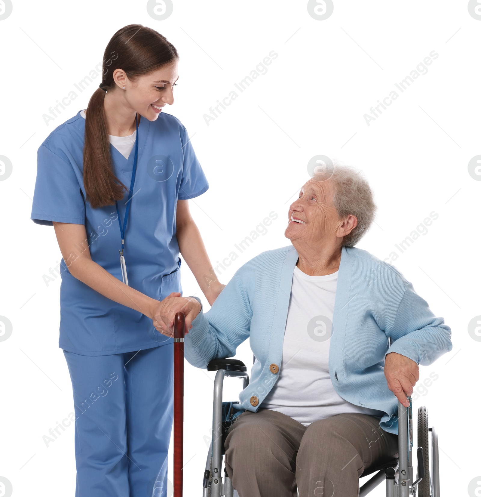 Photo of Caregiver assisting senior woman in wheelchair on white background. Home health care service