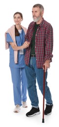 Photo of Caregiver supporting senior man with walking cane on white background. Home health care service