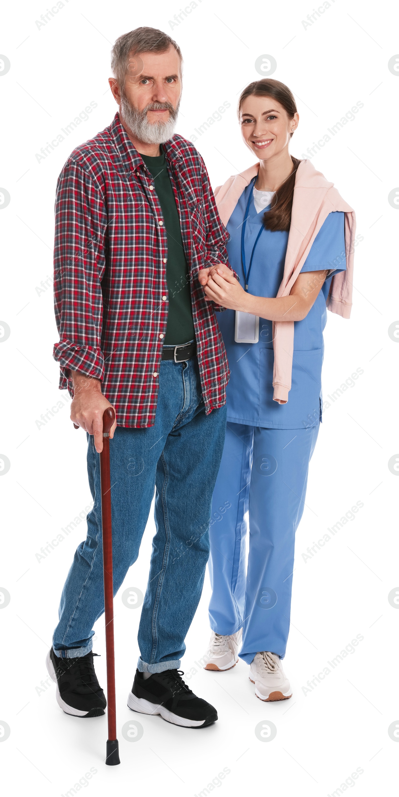 Photo of Caregiver supporting senior man with walking cane on white background. Home health care service