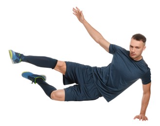 Football player in sportswear training on white background