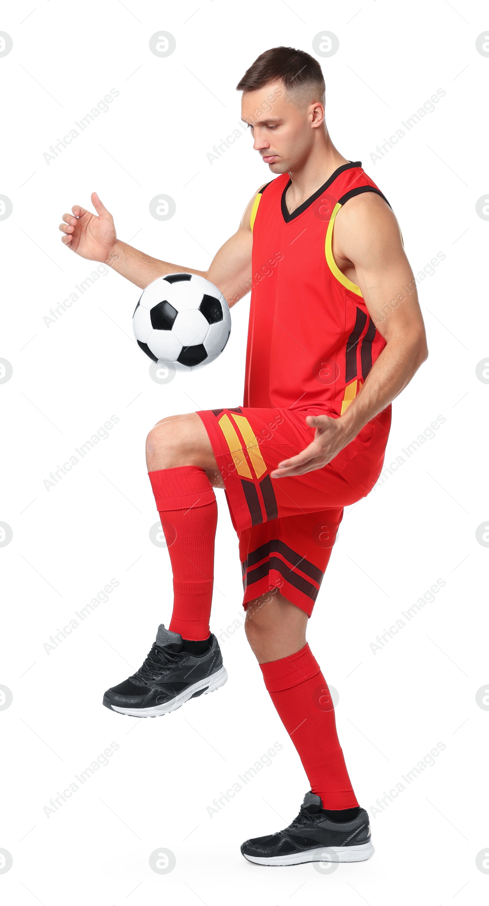 Photo of Man playing football with soccer ball on white background