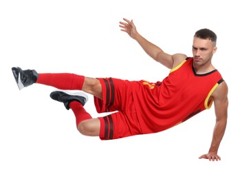 Football player in sportswear training on white background