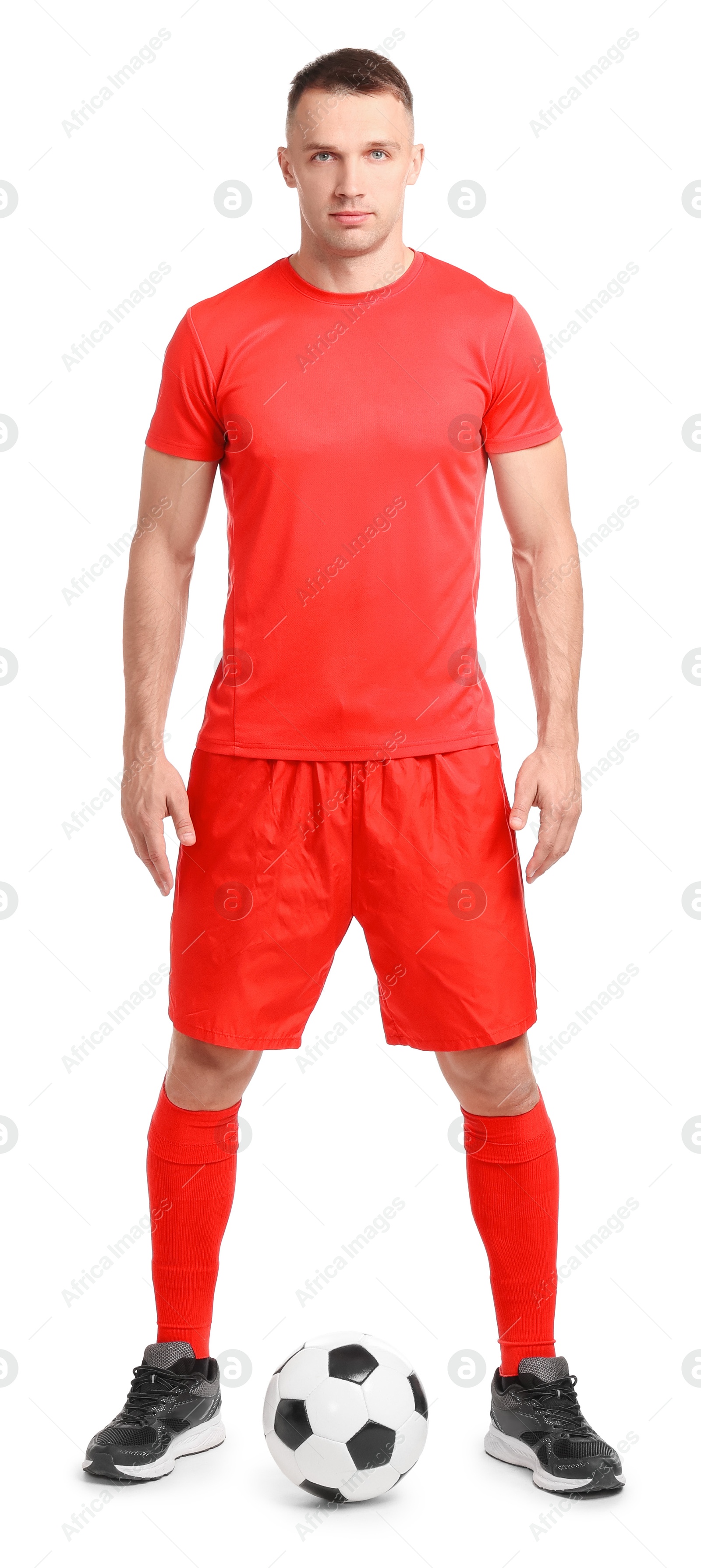 Photo of Football player with soccer ball on white background