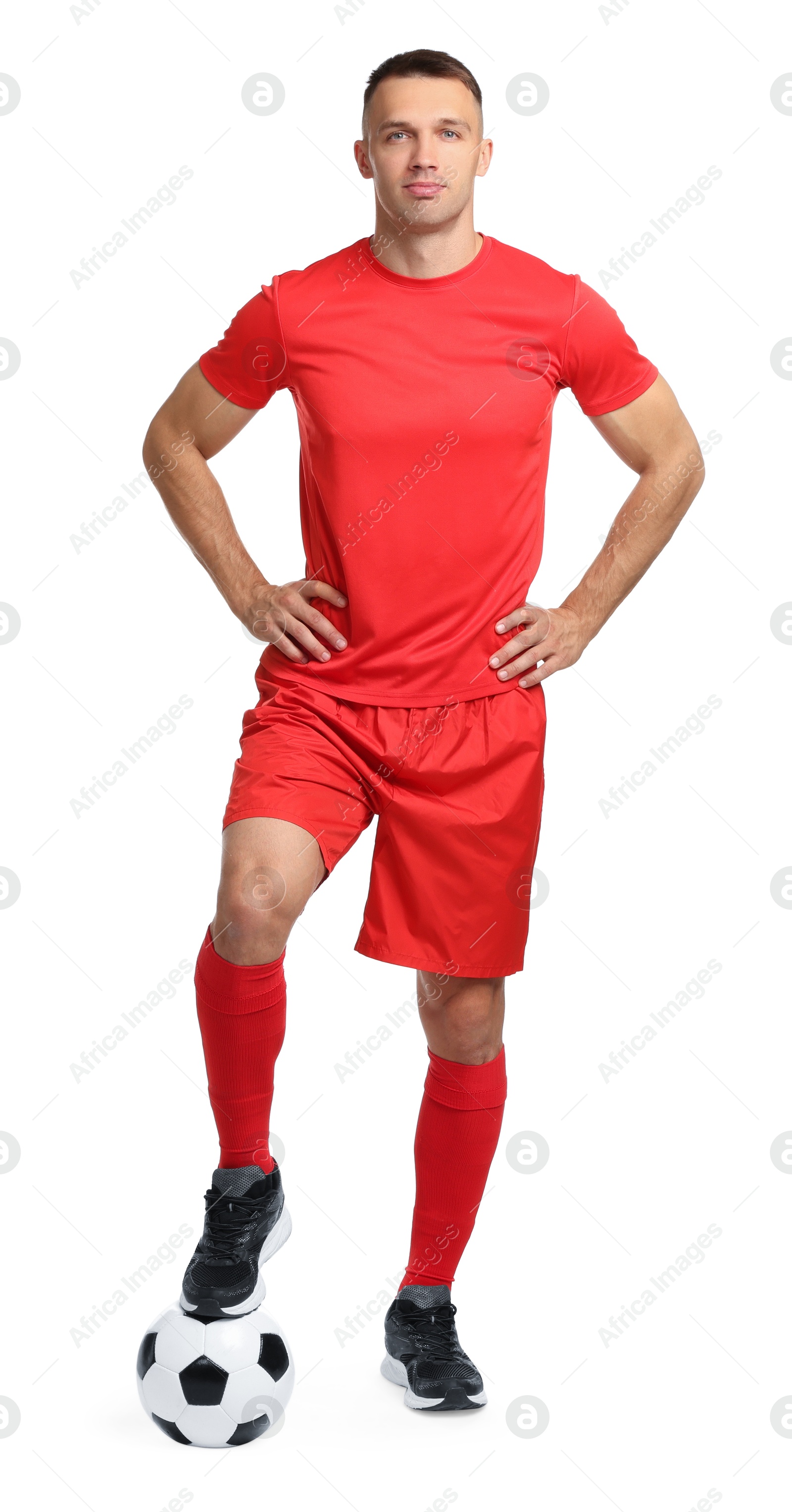 Photo of Football player with soccer ball on white background