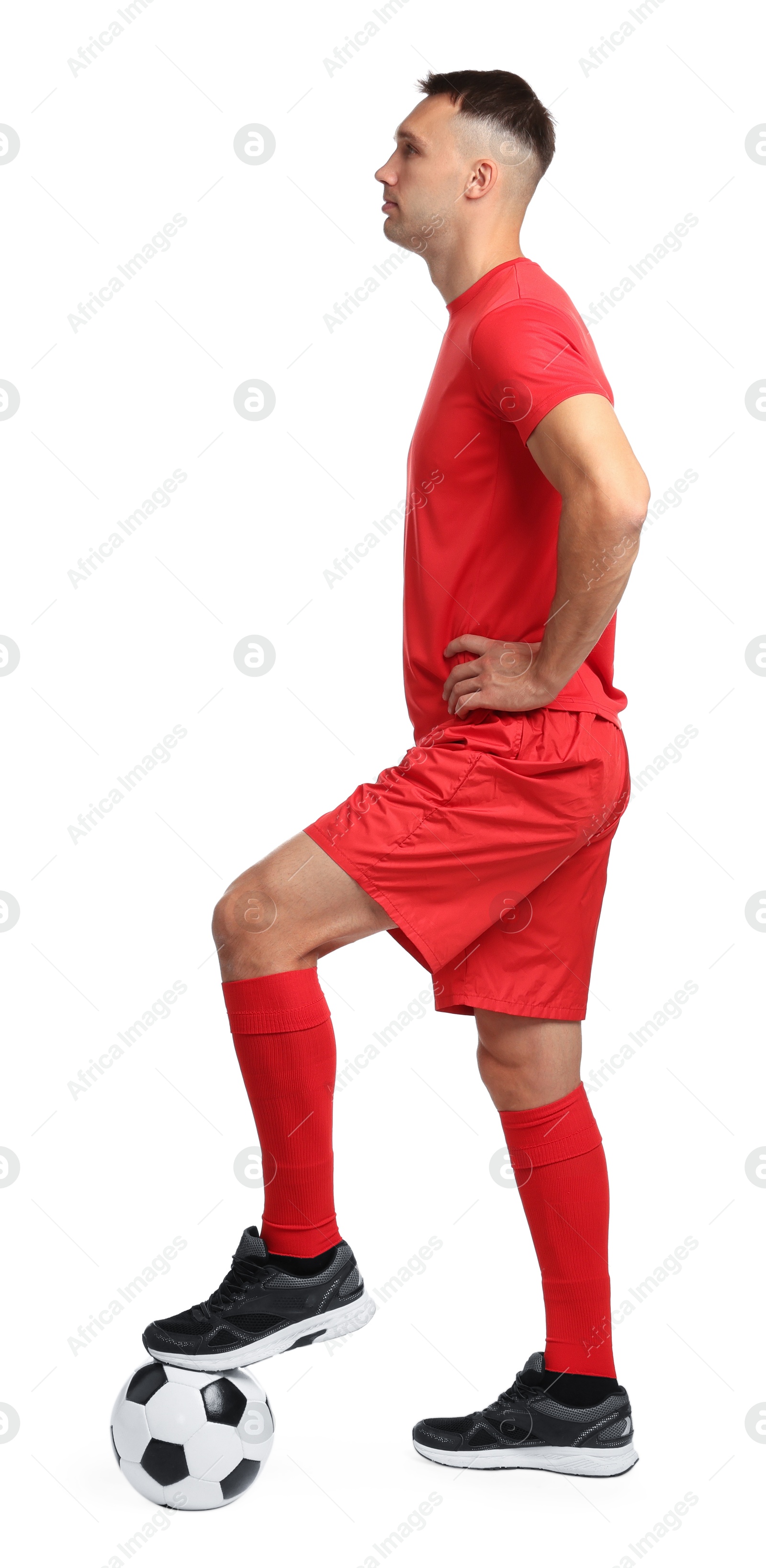 Photo of Football player with soccer ball on white background