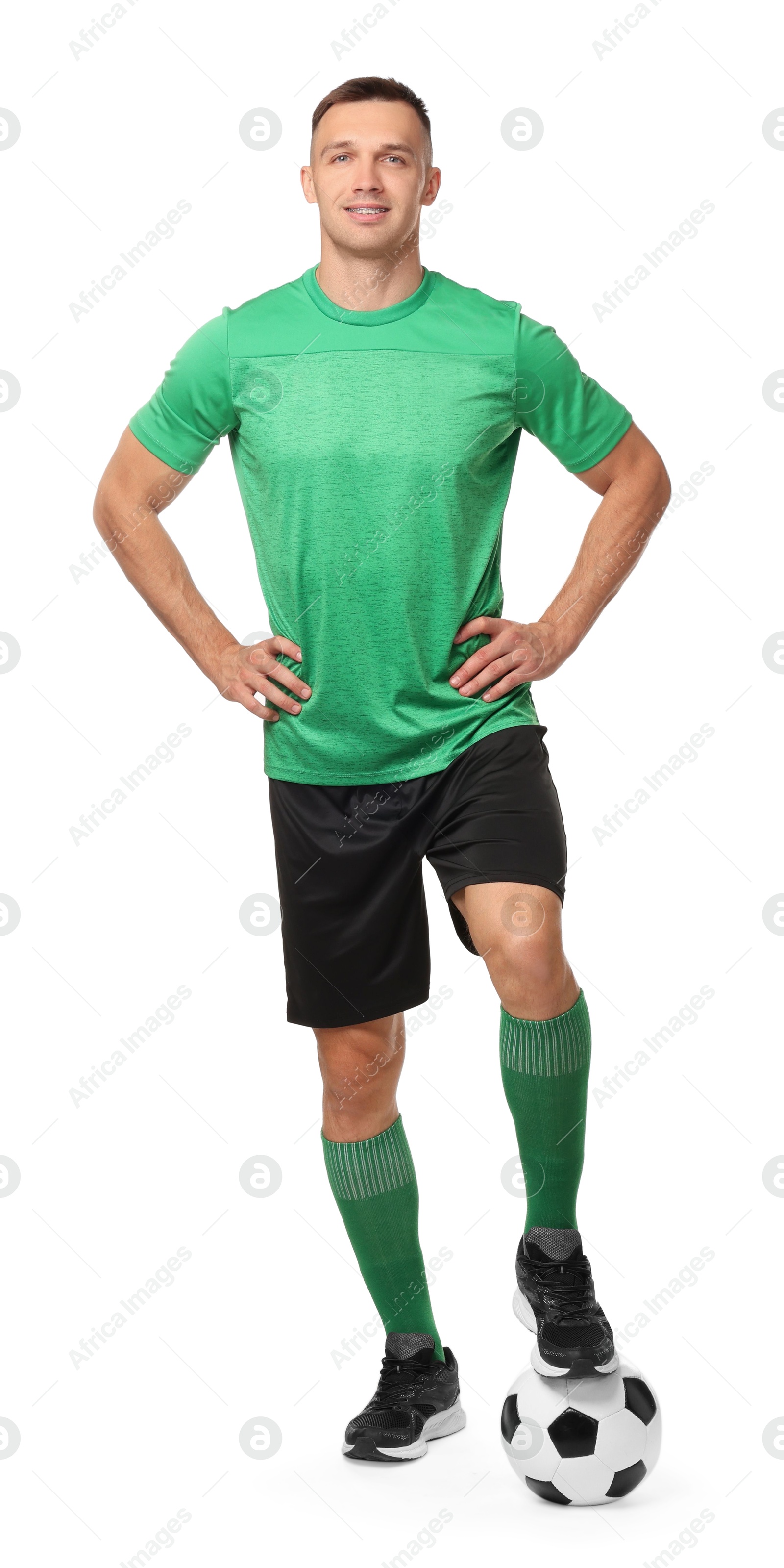 Photo of Smiling football player with soccer ball on white background