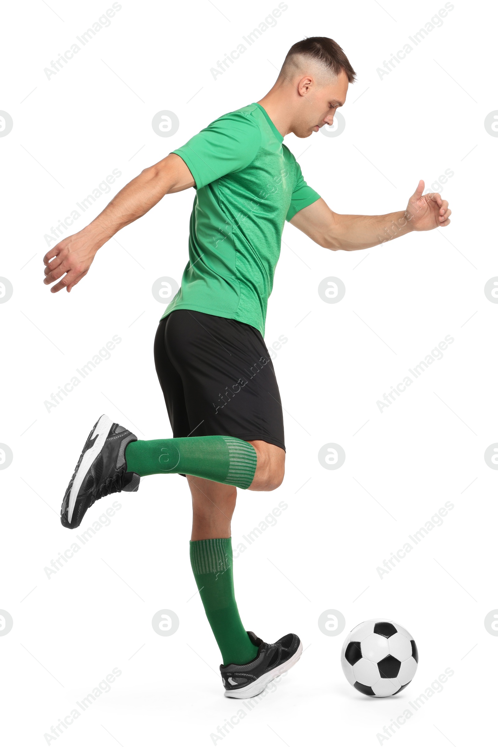 Photo of Man playing football with soccer ball on white background