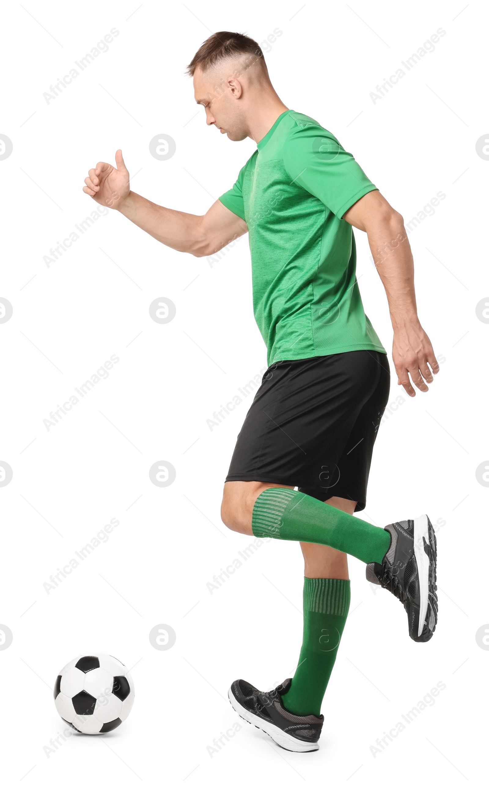 Photo of Man playing football with soccer ball on white background