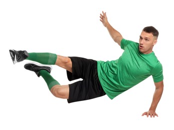 Photo of Football player in sportswear training on white background