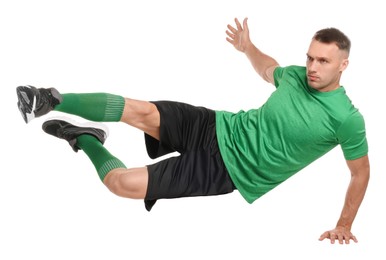 Football player in sportswear training on white background