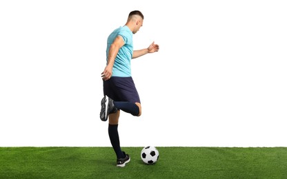 Photo of Man playing football with soccer ball on artificial grass against white background, back view