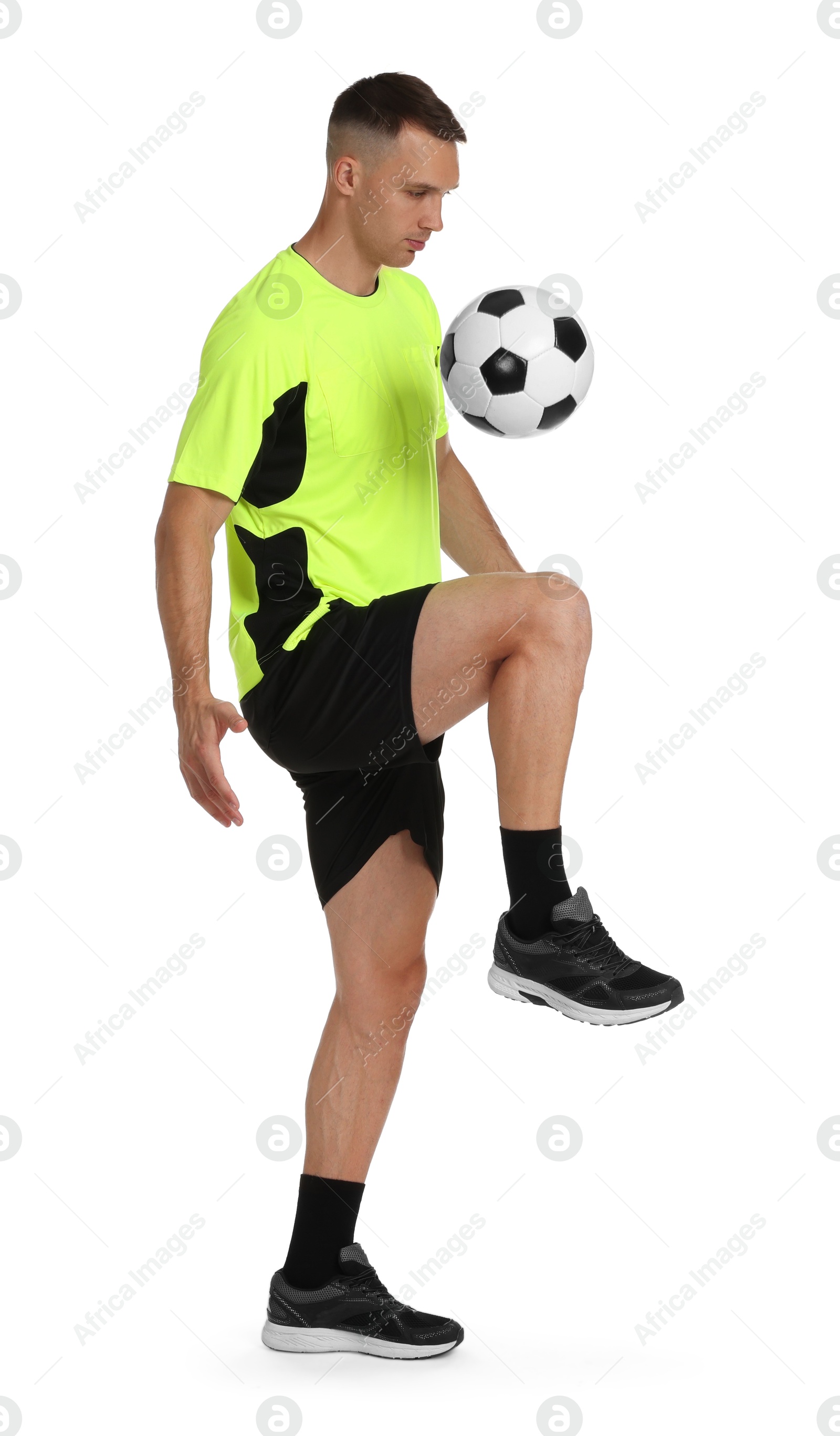 Photo of Man playing football with soccer ball on white background