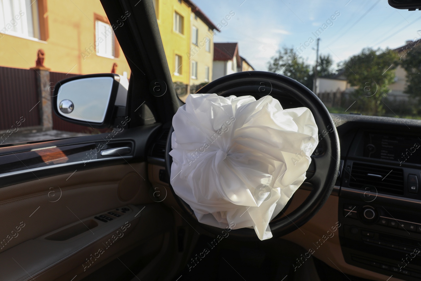 Photo of Opened airbag in automobile. Car safety equipment