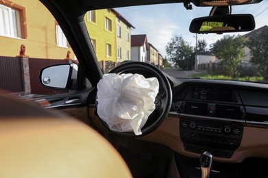 Opened airbag in automobile. Car safety equipment