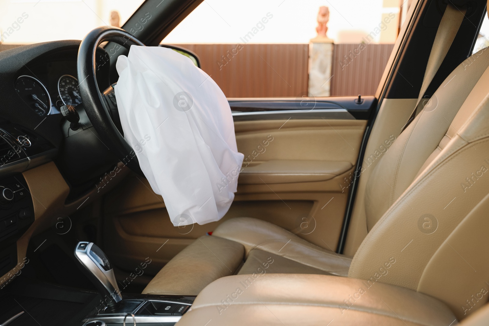 Photo of Opened airbag in automobile. Car safety equipment