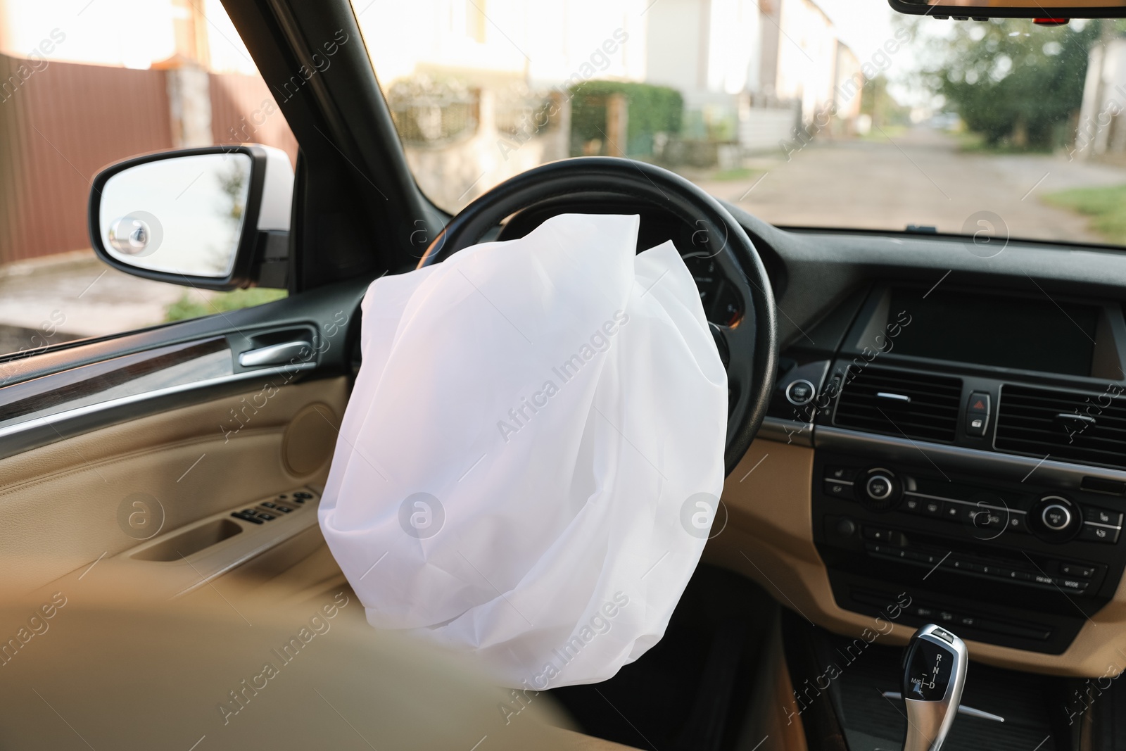 Photo of Opened airbag in automobile. Car safety equipment