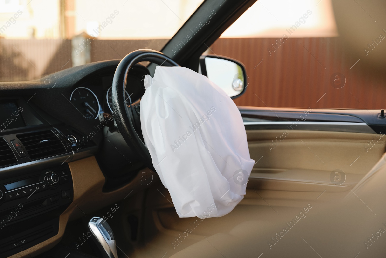 Photo of Opened airbag in automobile. Car safety equipment