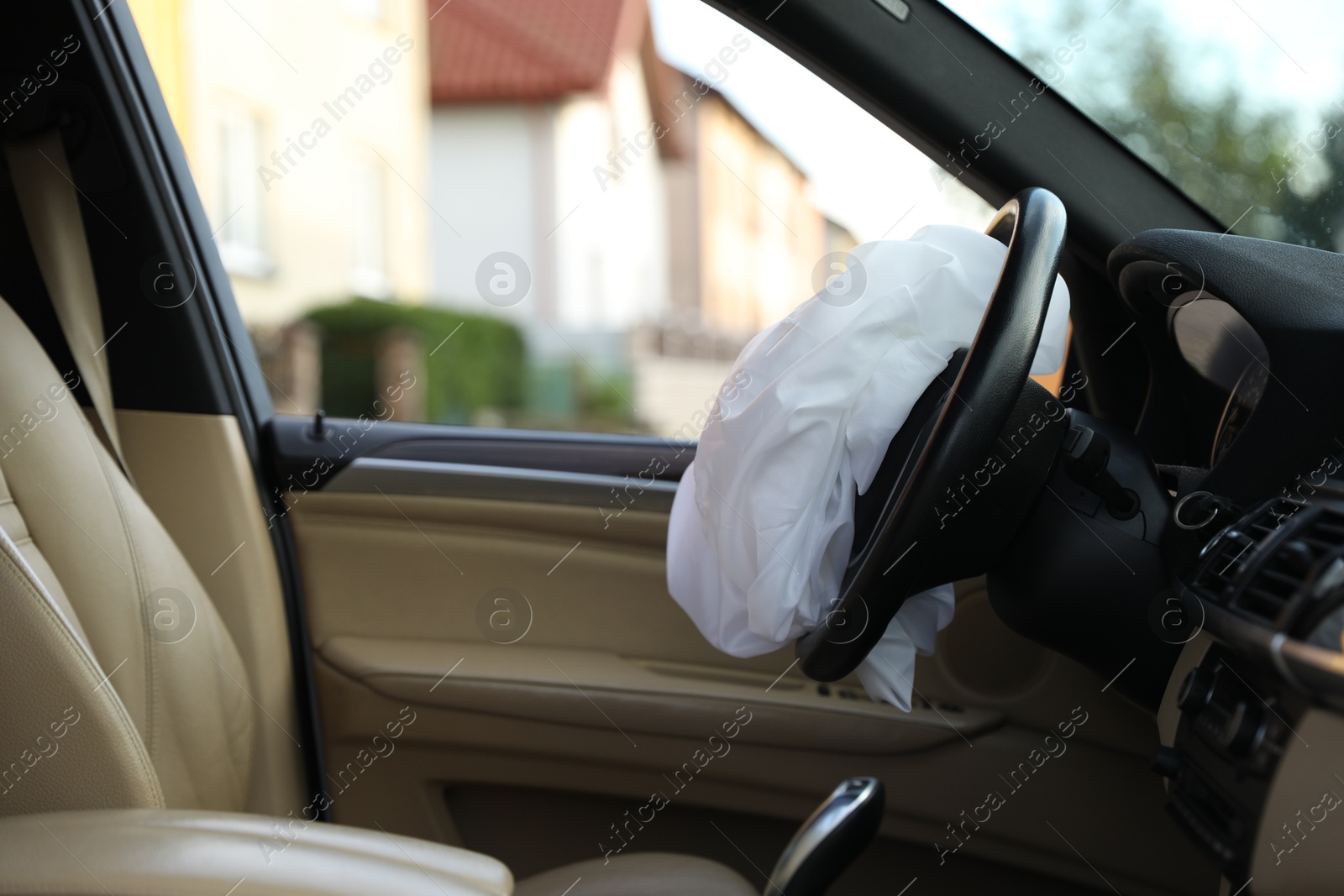 Photo of Opened airbag in automobile. Car safety equipment