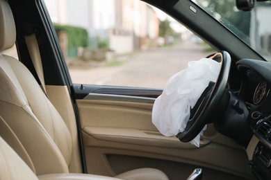 Opened airbag in automobile. Car safety equipment