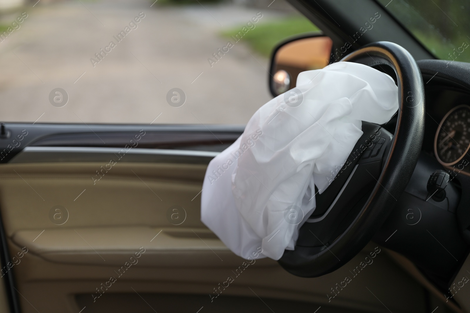 Photo of Opened airbag in automobile. Car safety equipment