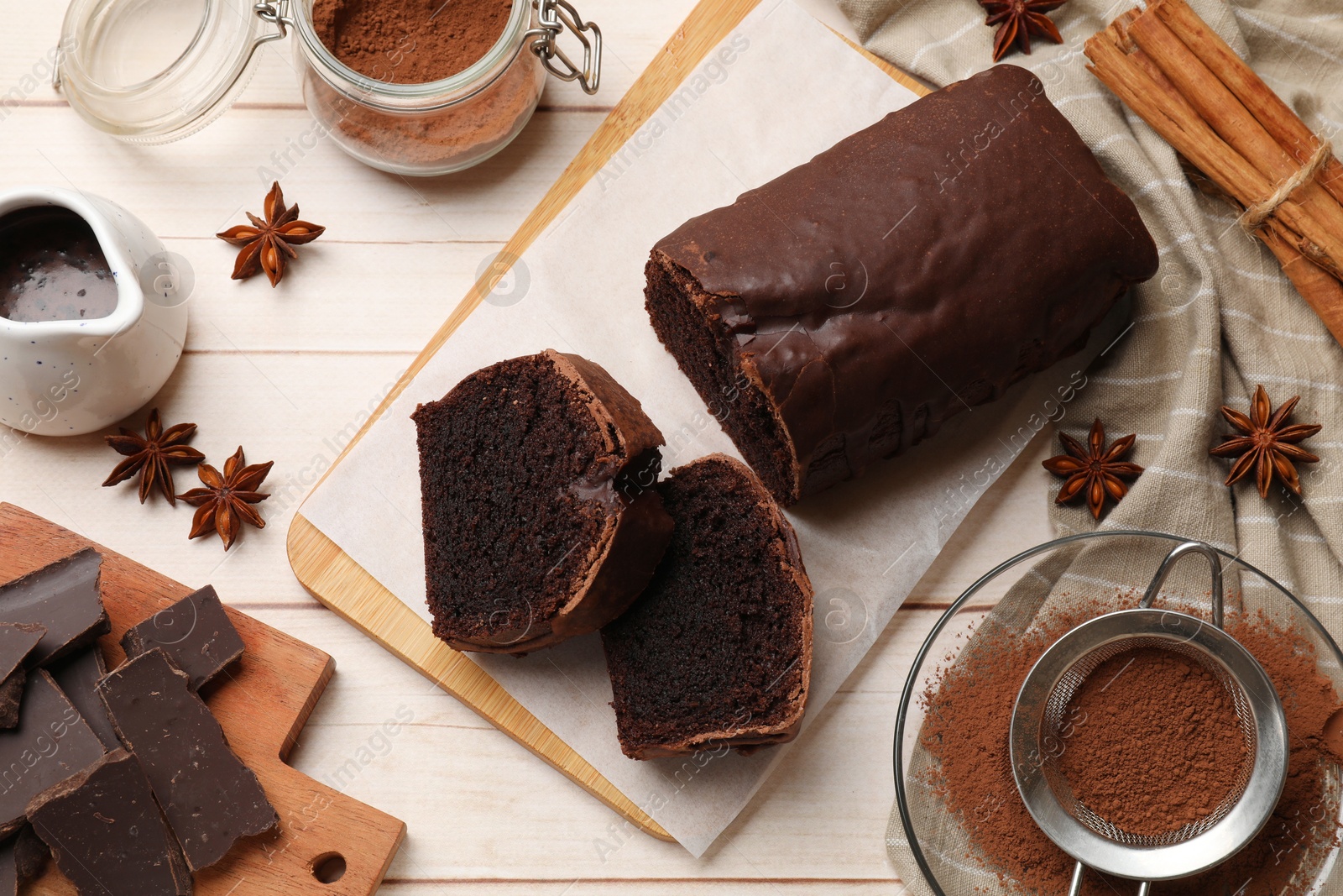 Photo of Delicious chocolate sponge cake on white wooden table