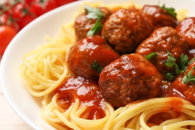 Photo of Delicious pasta with meatballs on table, closeup