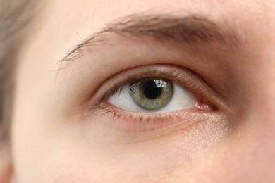 Photo of Closeup view of young woman with beautiful eyes