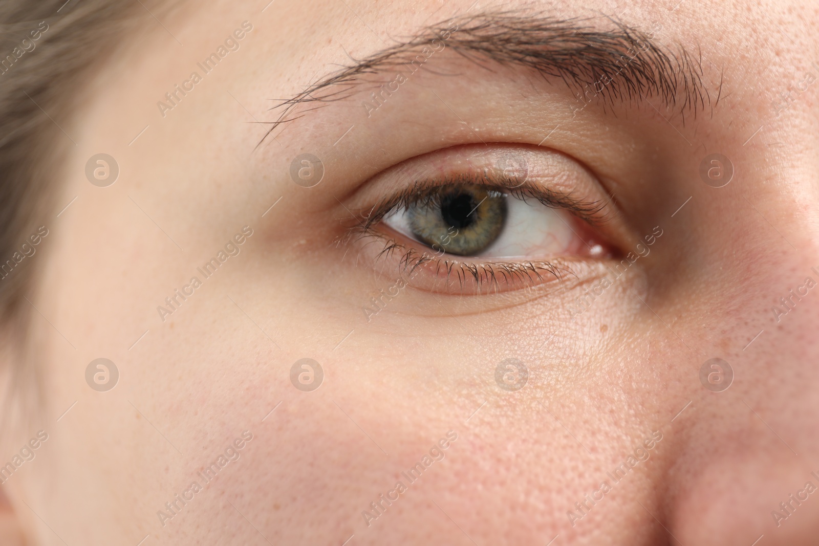 Photo of Closeup view of young woman with beautiful eyes