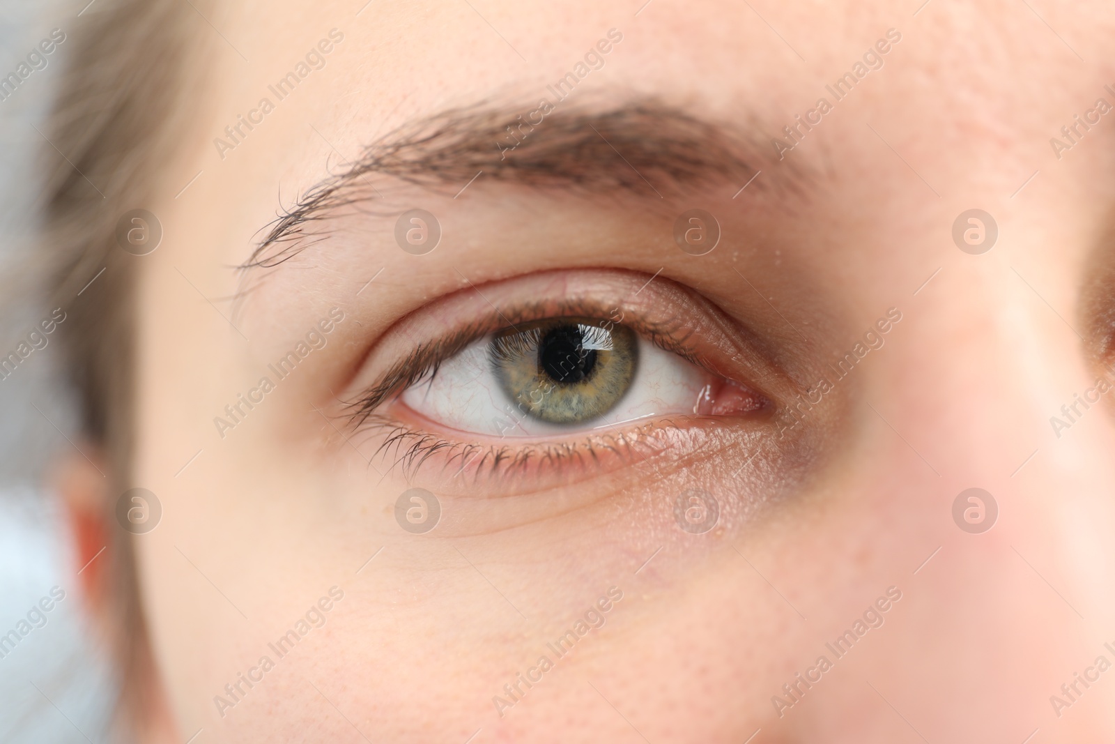 Photo of Closeup view of young woman with beautiful eyes