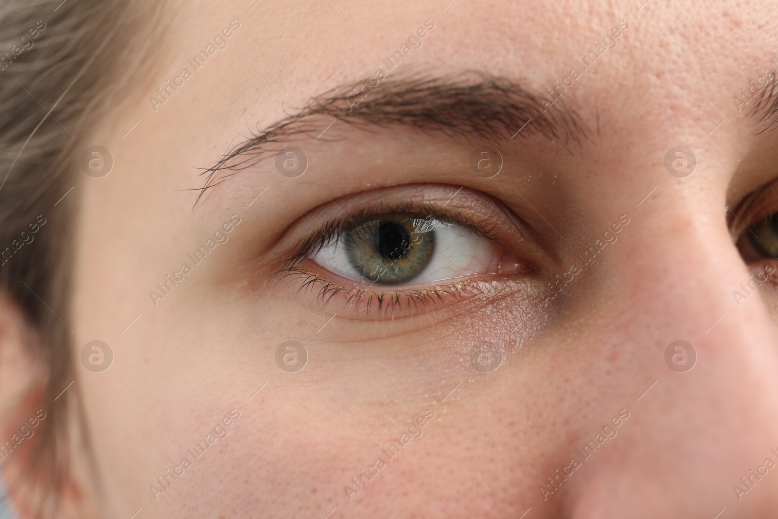 Photo of Closeup view of young woman with beautiful eyes