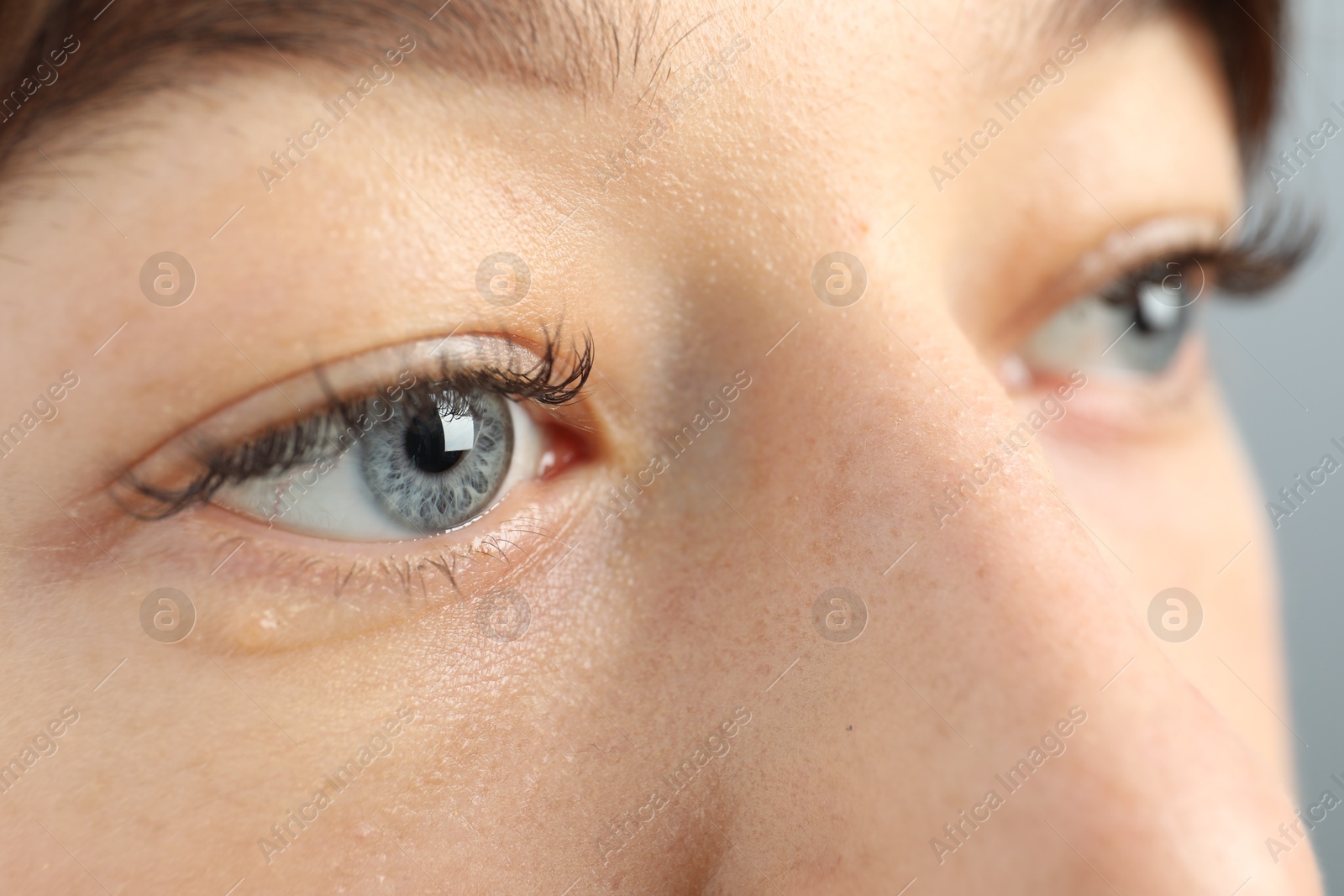 Photo of Closeup view of young woman with beautiful blue eyes