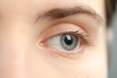 Photo of Macro view of young woman with beautiful blue eyes