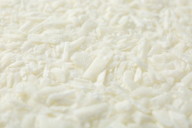 Photo of White soy wax flakes as background, closeup