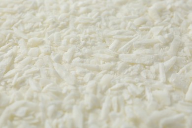 Photo of White soy wax flakes as background, closeup