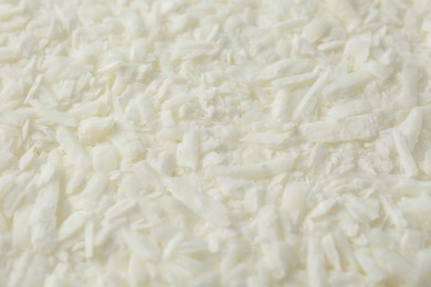 Photo of White soy wax flakes as background, closeup