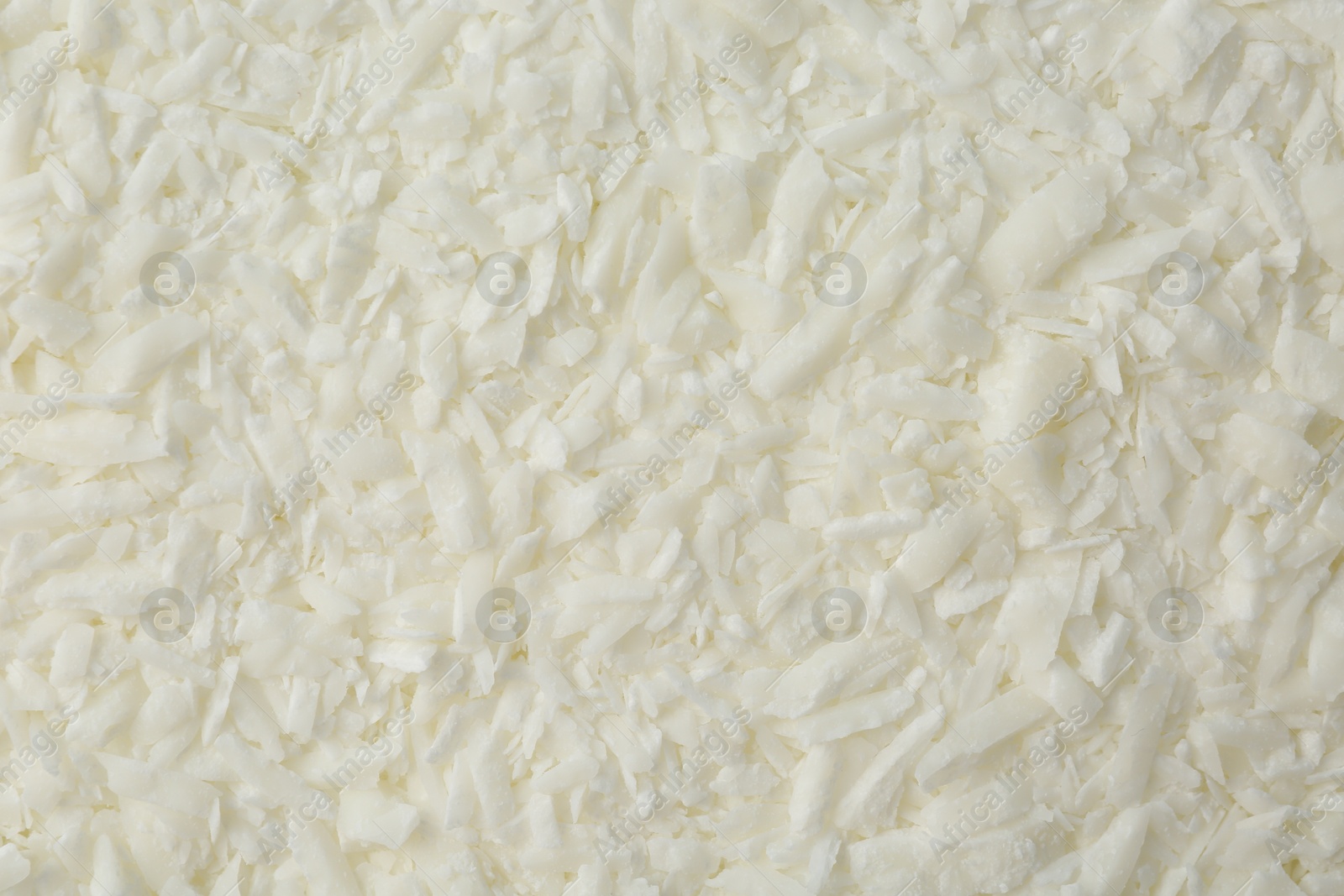 Photo of White soy wax flakes as background, closeup