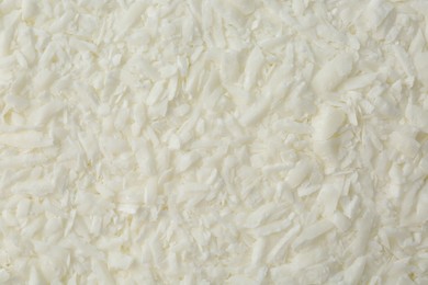 Photo of White soy wax flakes as background, closeup