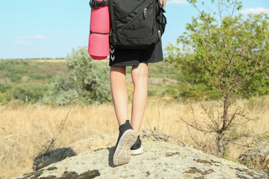 Photo of Little boy travelling outdoors on sunny day, closeup