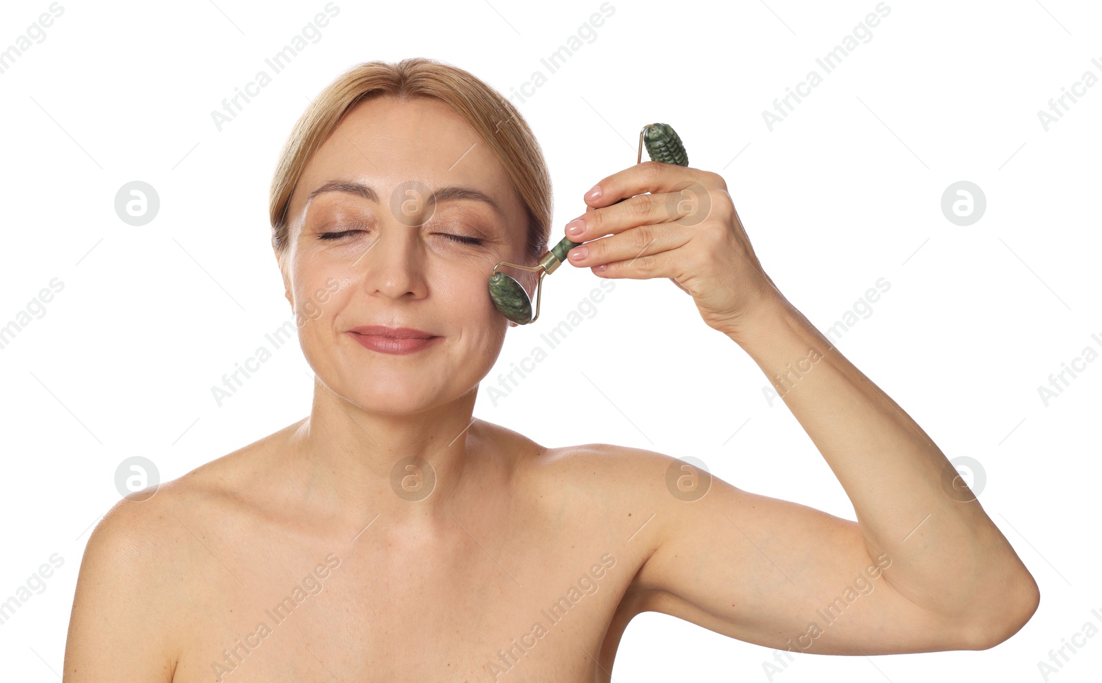 Photo of Beautiful woman doing facial self massage with roller on white background