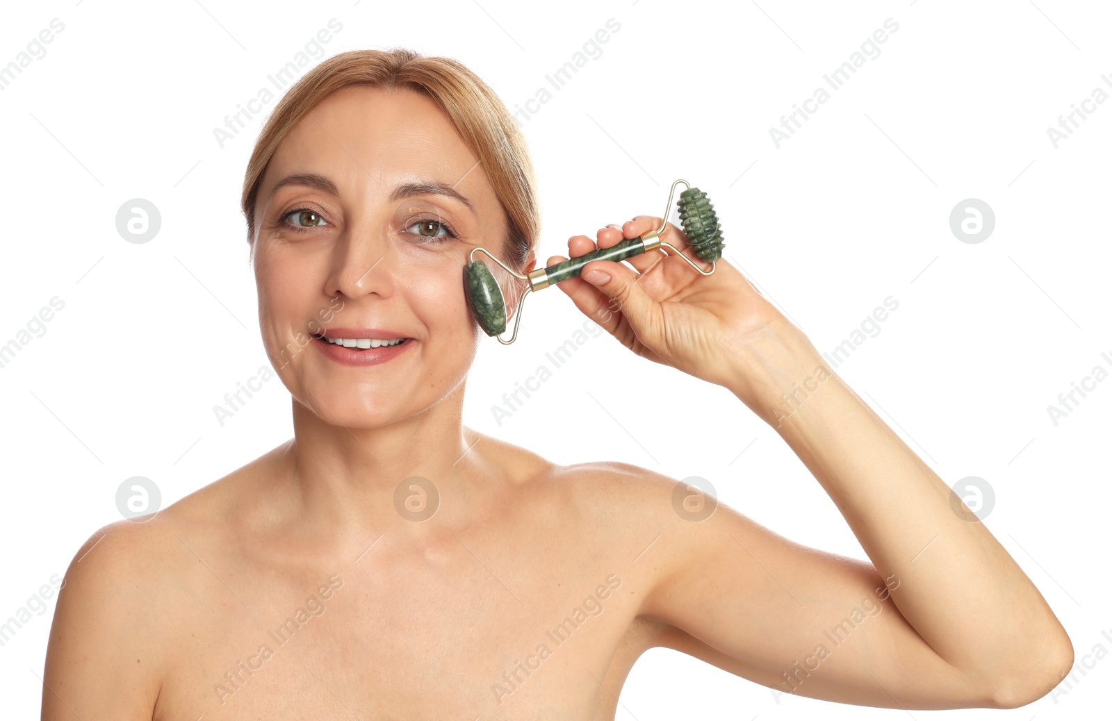 Photo of Smiling woman doing facial self massage with roller on white background