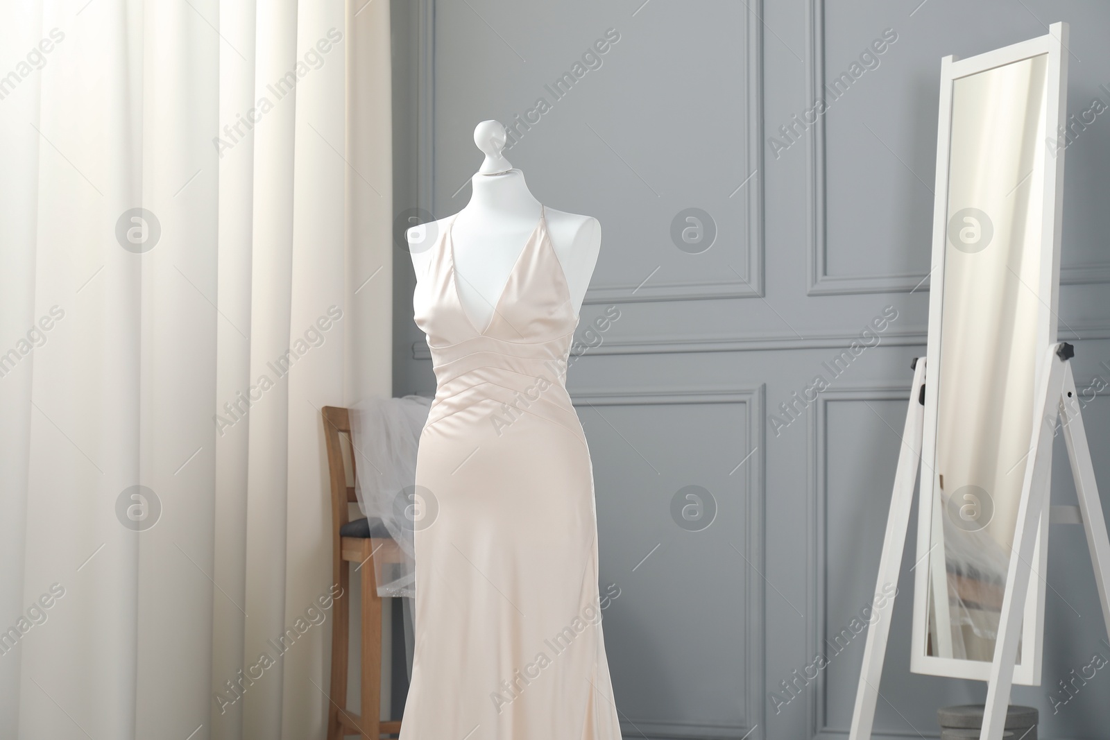 Photo of Beautiful wedding dress on mannequin in boutique